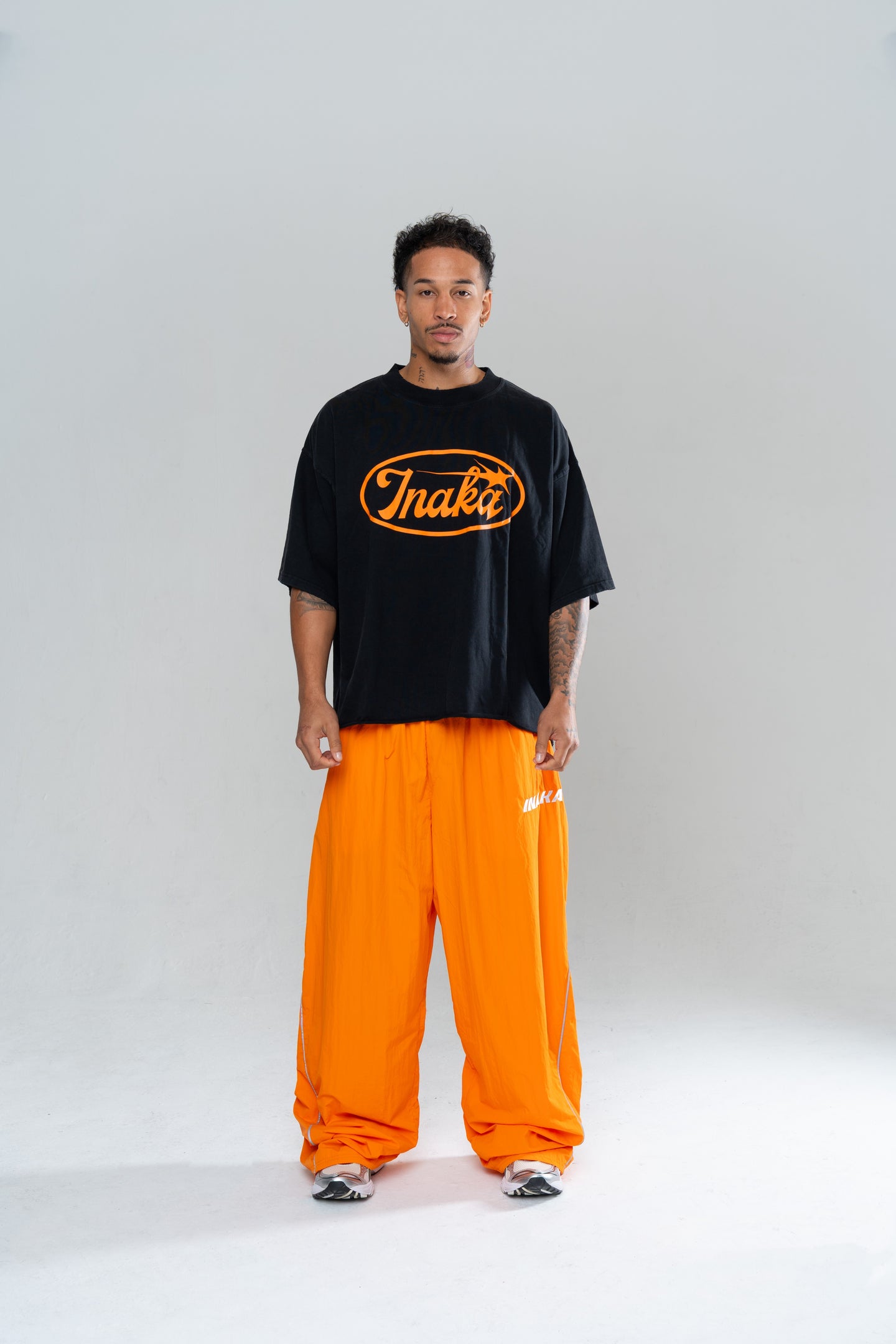 ICONIC BAGGY TRACKPANTS - ORANGE