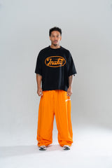 ICONIC BAGGY TRACKPANTS - ORANGE